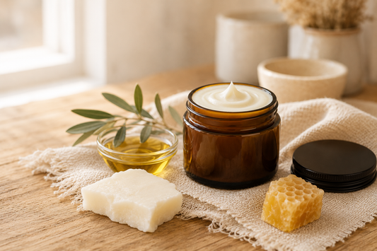 Jar of whipped tallow balm with its three ingredients, grass-fed tallow, olive oil, and beeswax, handmade in Cambria, NY