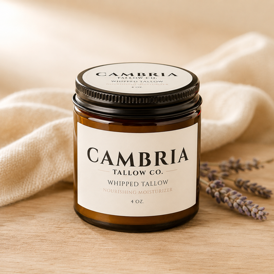 Cambria Tallow Co whipped tallow balm in a clear glass jar, a grass-fed beef tallow moisturizer handmade in Cambria, NY